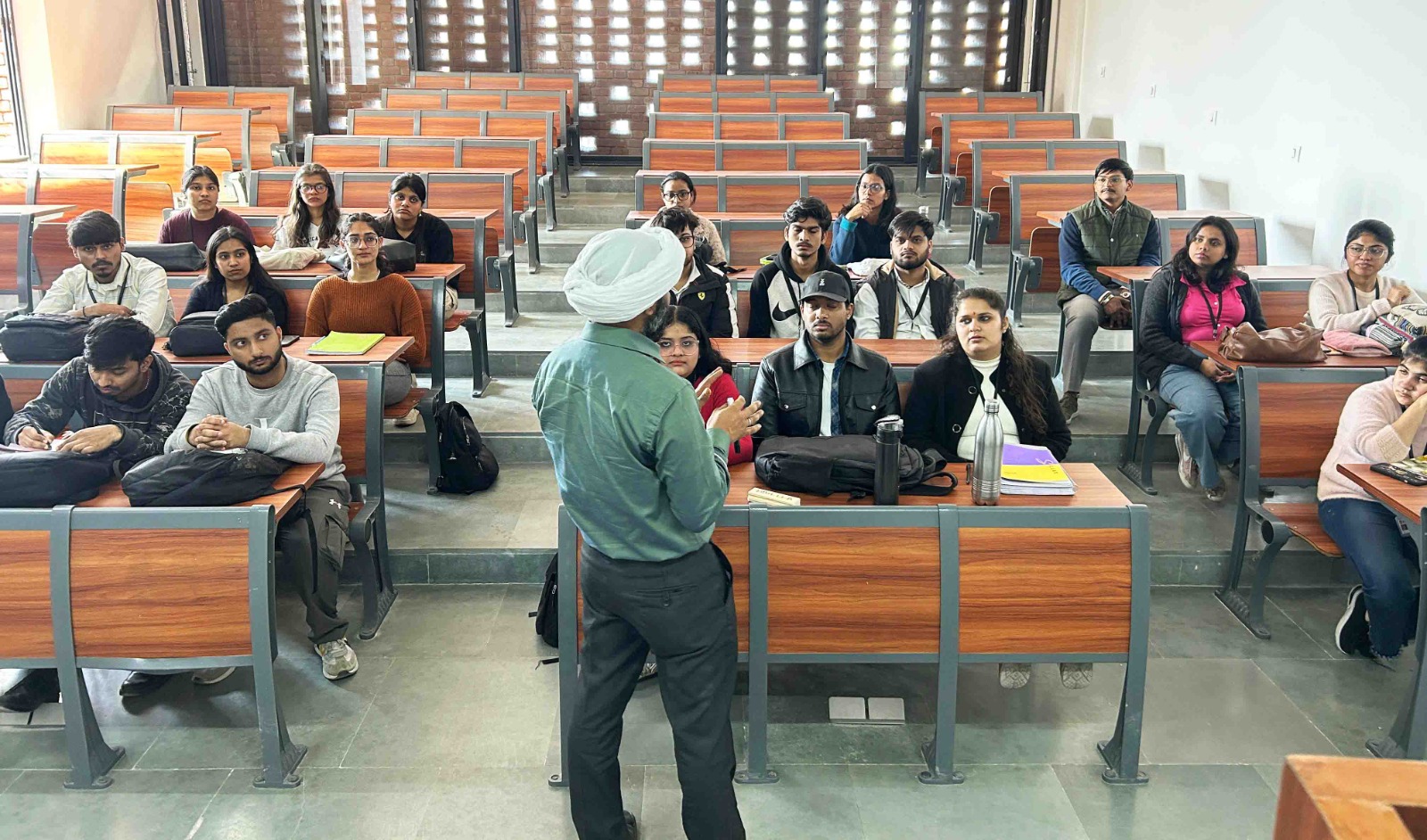 Teacher smiling with children in a classroom
