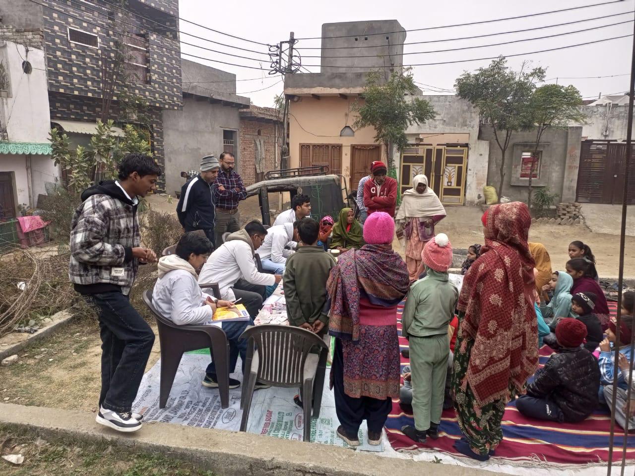 Health camp team assisting community members